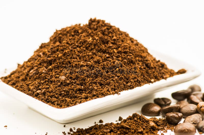 Freshly Grinded Coffee Being Emptied Onto Coffee Holder Series 3