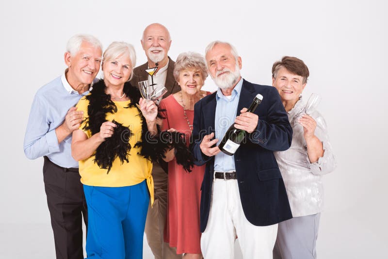 Active elegant senior people having fun during anniversary party stock photography