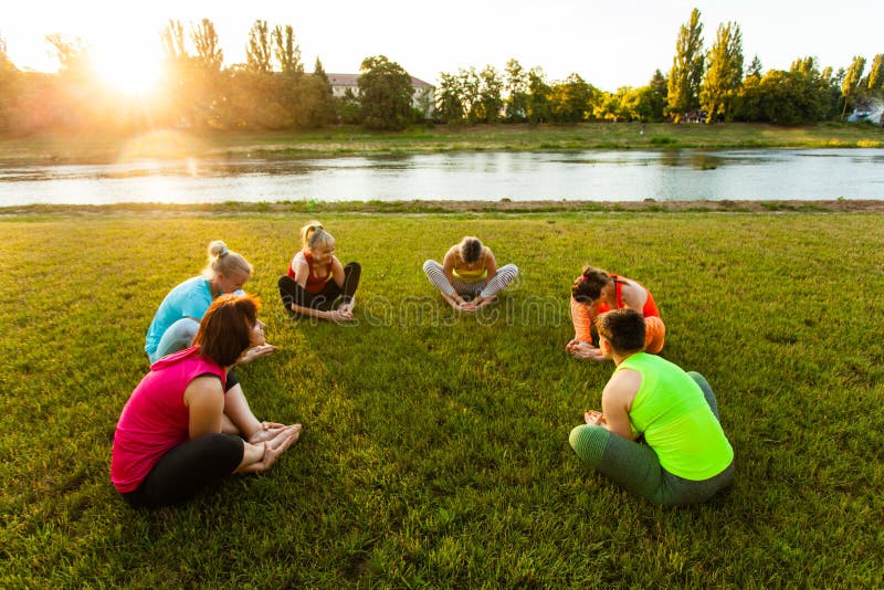 Active Women Practicing Yoga Outside Stock Photo Image Of Adult Group
