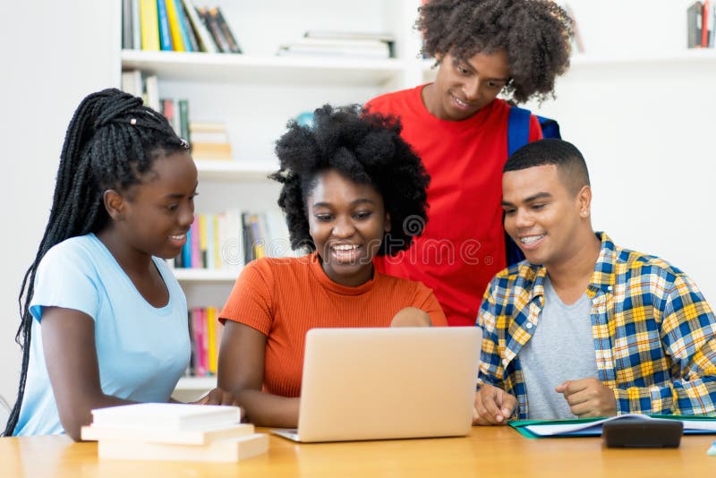 Group of african american and latin students working and learning at computer at classroom of university. Computer editing stock images, royalty-free photos and pictures