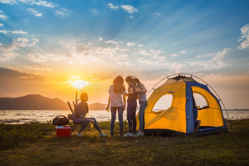 Group of asian women party with drink bottles enjoy travel camping royalty free stock photo Group of asian women party with drink bottles enjoy travel camping royalty free stock photo