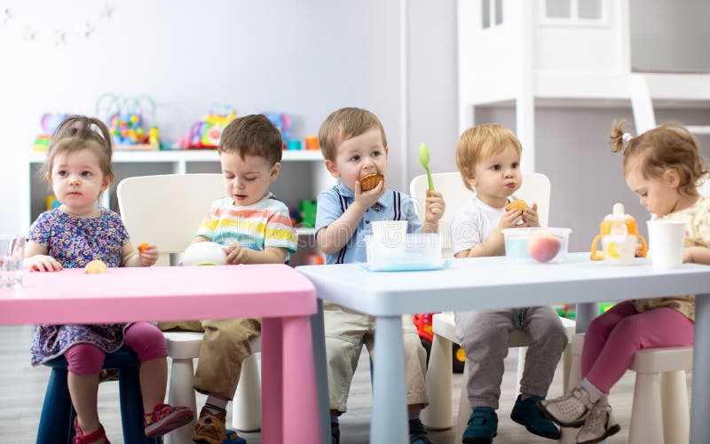 Babies Have Lunch in Nursery Stock Image Image of caucasian, funny