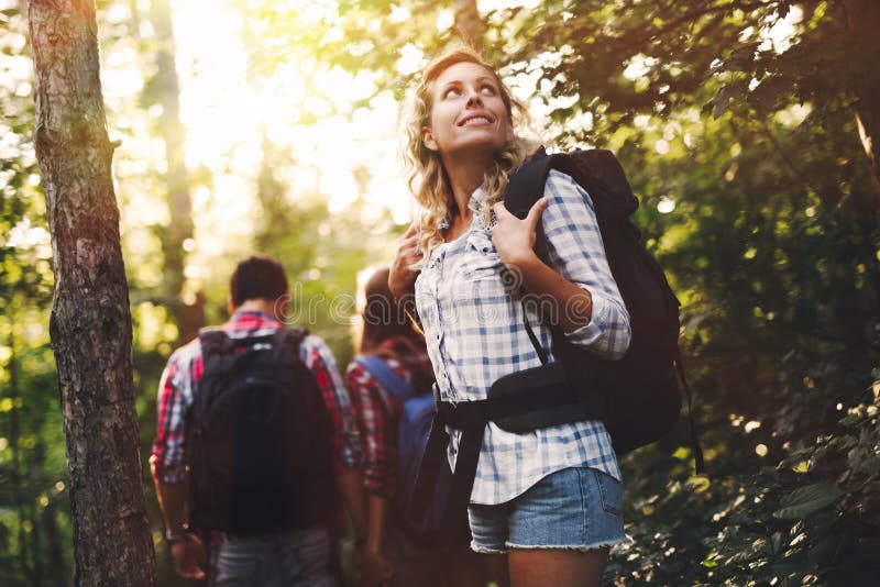 Group of Backpacking Hikers Going for Forest Trekking Stock Image