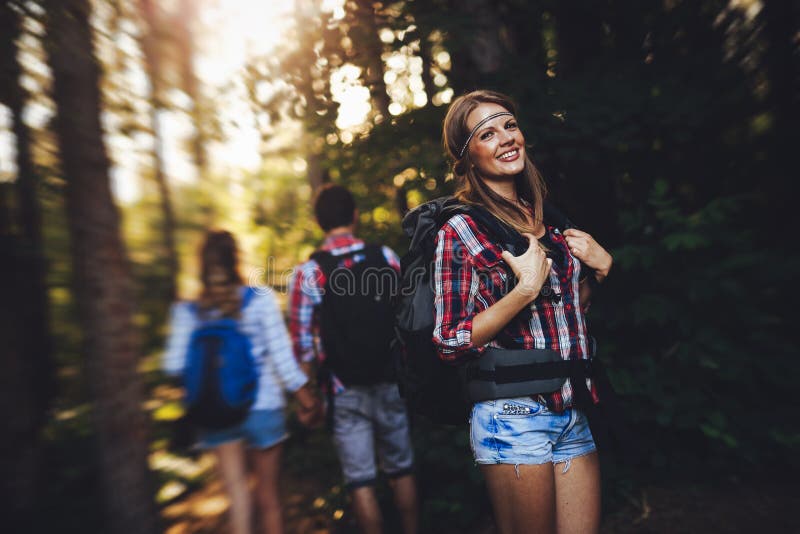 Group of Backpacking Hikers Going for Forest Trekking Stock Image