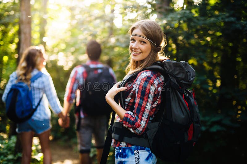 Group of Backpacking Hikers Going for Forest Trekking Stock Image