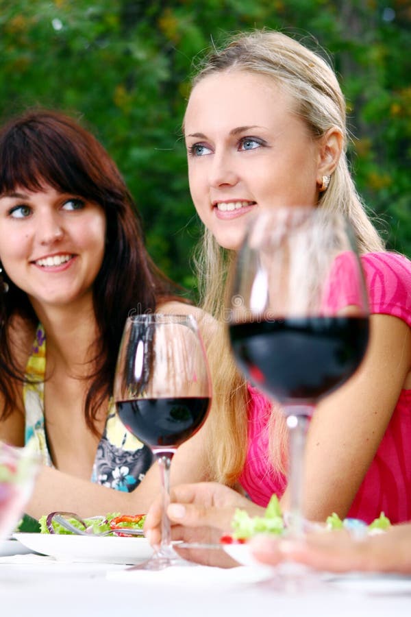 Group of beautiful girls drinking wine