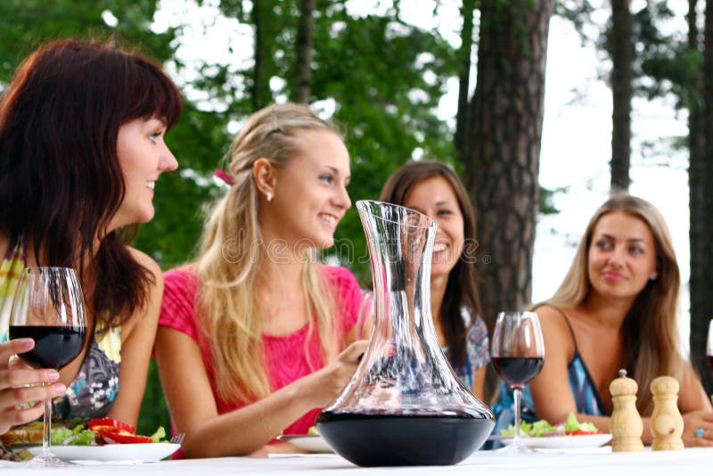 Group of beautiful girls drinking wine