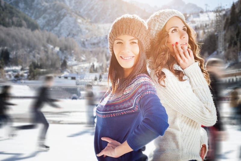 Group beautiful teenager girls ice skating outdoor at ice rink