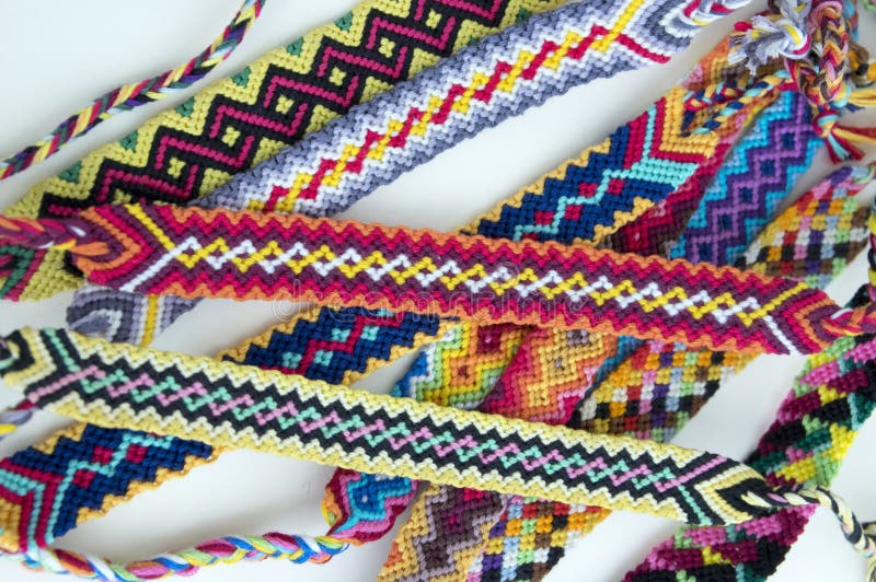 Group Of Simple Handmade Homemade Natural Woven Bracelets Of Friendship On  Wooden Background Rainbow Colors Checkered Pattern Stock Photo - Download  Image Now - iStock