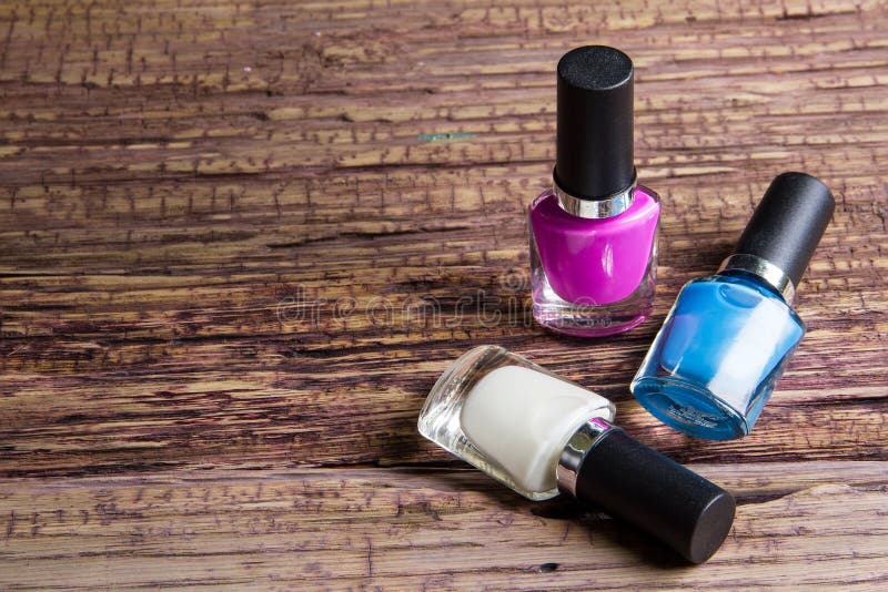 Group of Bright Nail Polishes on Brown Wood Stock Photo Image of