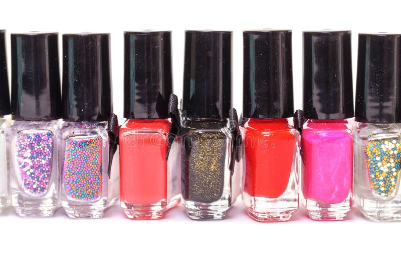 A Large Set of Multicolored Nail Polishes. Rainbow Jars with Nail