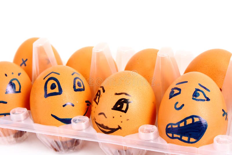 Group of brown hen's eggs with different faces in the box