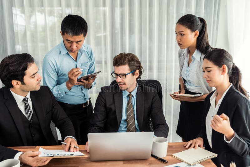 Group of business analyst team analyzing financial data report. Meticulous royalty free stock image