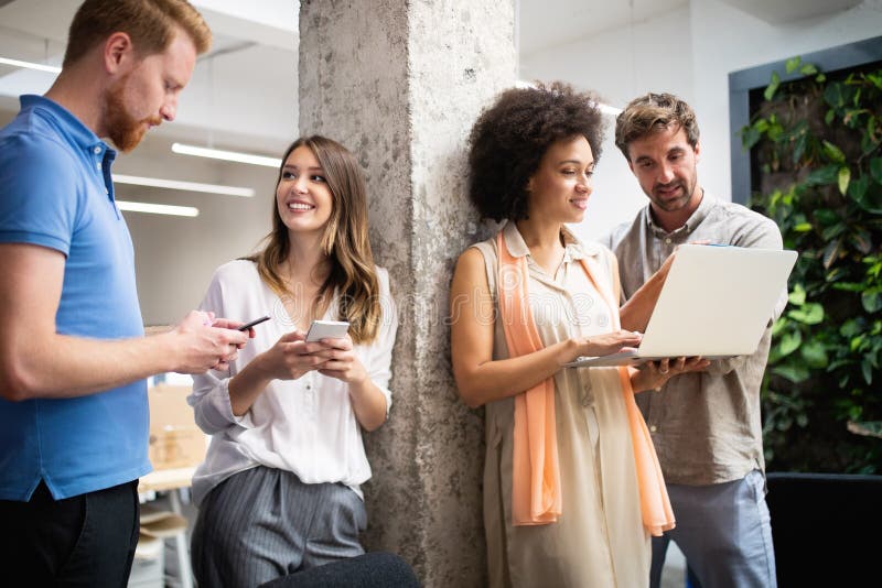 Group of business people collaborating on project in office stock photos Group of business people collaborating on project in office stock photos