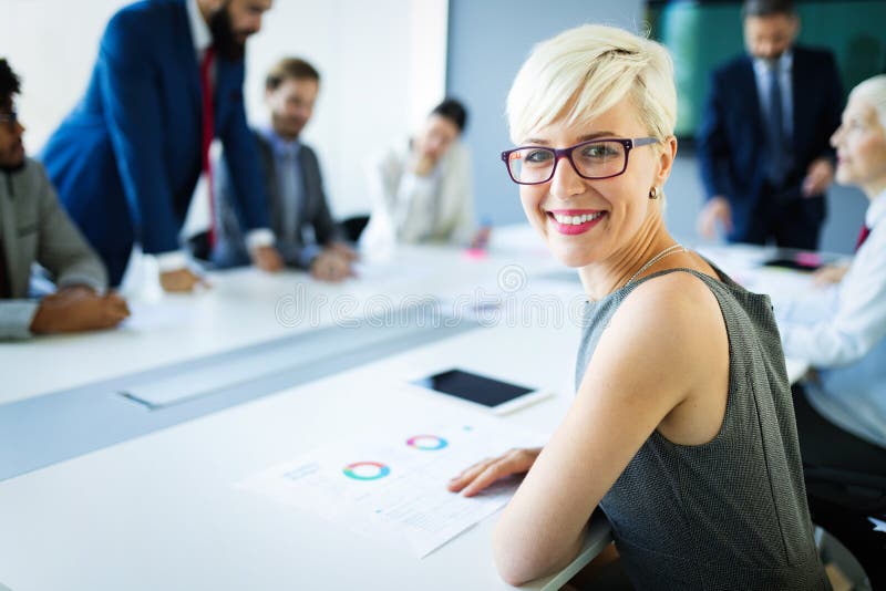 Group of business people discussing, brainstorming in office. Concentrated at work. royalty free stock photos Group of business people discussing, brainstorming in office. Concentrated at work. royalty free stock photos