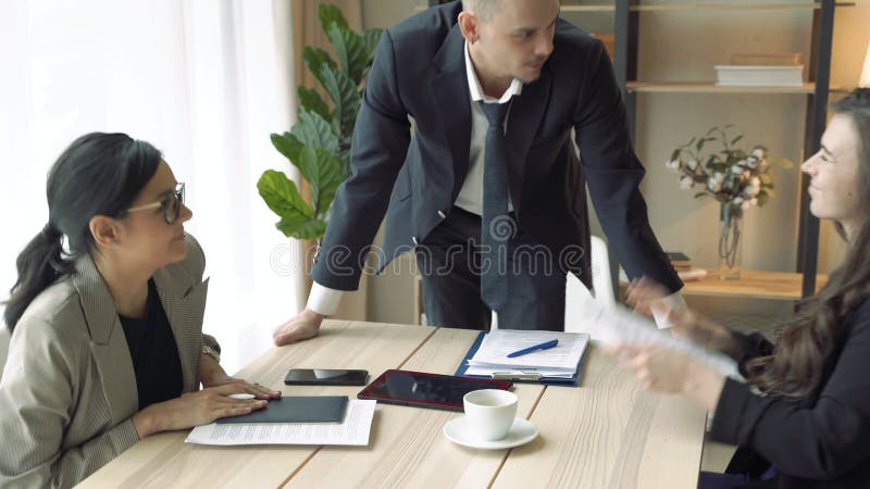 Group of business people ending meeting in office