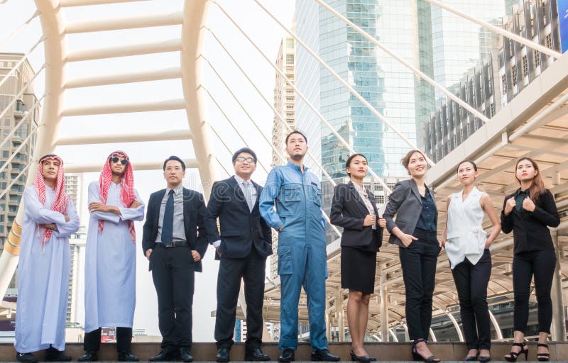 Group of Business People international have Arab , engineer , businessman Meeting with Sunset and city background. royalty free stock images