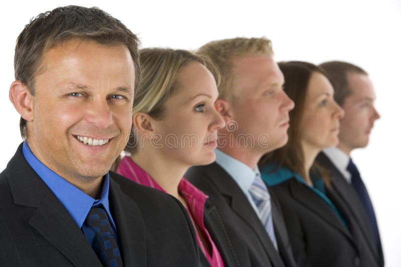Group Of Business People In A Line Smiling stock photos Group Of Business People In A Line Smiling stock photos