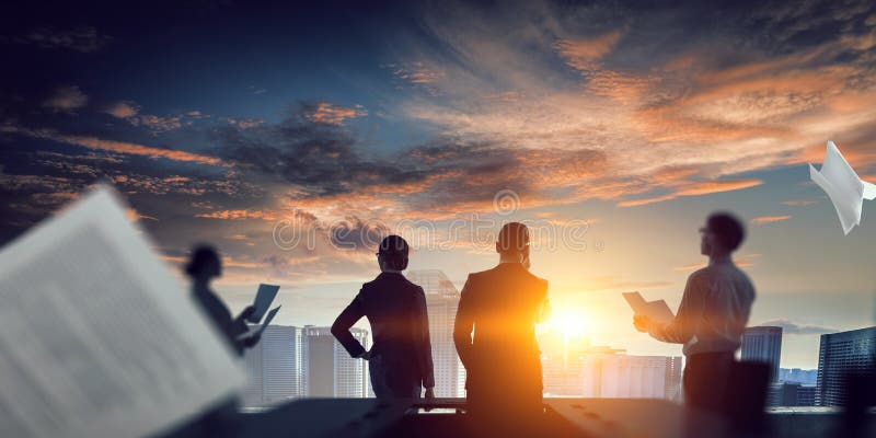 Group of business people outlines with lit background stock photos