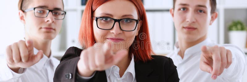 A group of business people pointing their finger at the camera and saying we choose you are engaged in a posse of employees and selecting the prosessians for the customer head hunter.