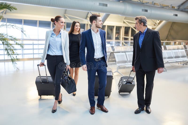 Group of Business People Travels As a Team in the Airport Stock Photo ...