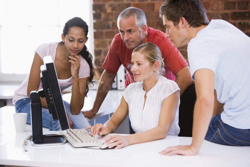 Group of business people working around computer