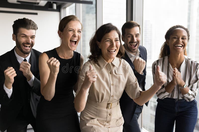 Group of businesspeople celebrating achievement, looks enthusiastic and joyful stock photography