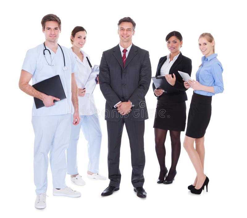 Happy Group Of Businesspeople And Doctors Standing Over White Background. Standing file folder stock images, royalty-free photos and pictures