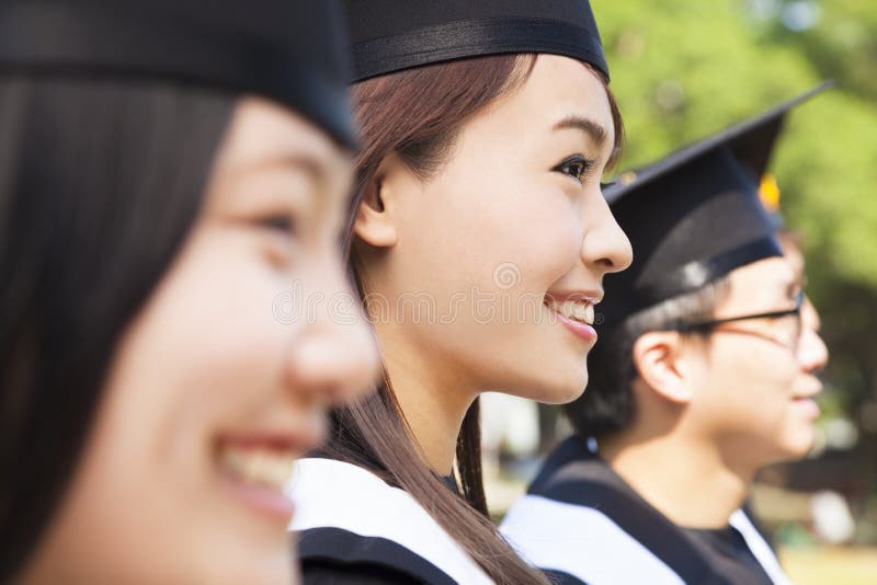 A group cheerful college graduates at graduation stock photo