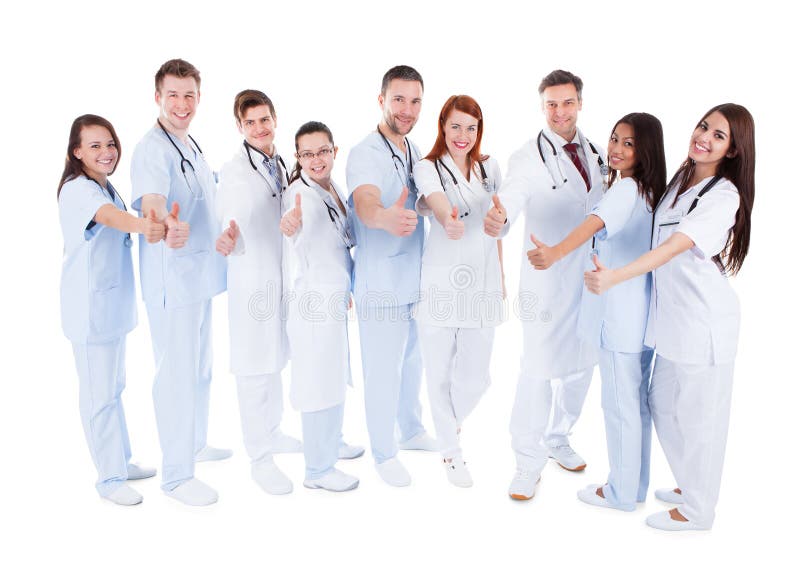 Group of cheerful doctors showing thumbs up stock photo Group of cheerful doctors showing thumbs up stock photo