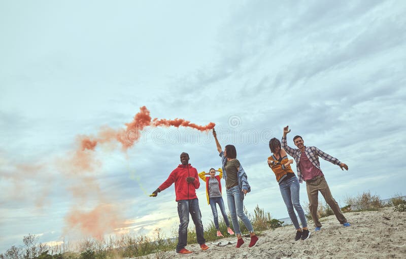 Group of cheerful friends are happy on seaside stock photo Group of cheerful friends are happy on seaside stock photo