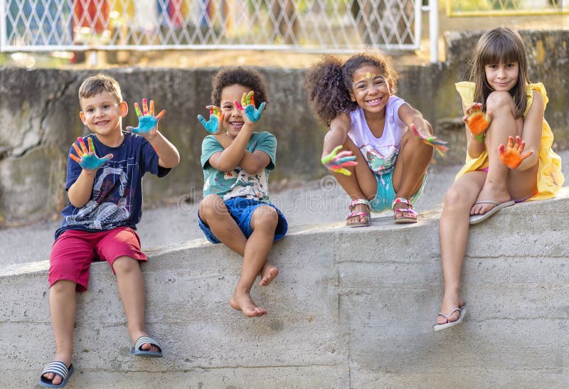 Group of cheerful multicultural children playing together royalty free stock photos