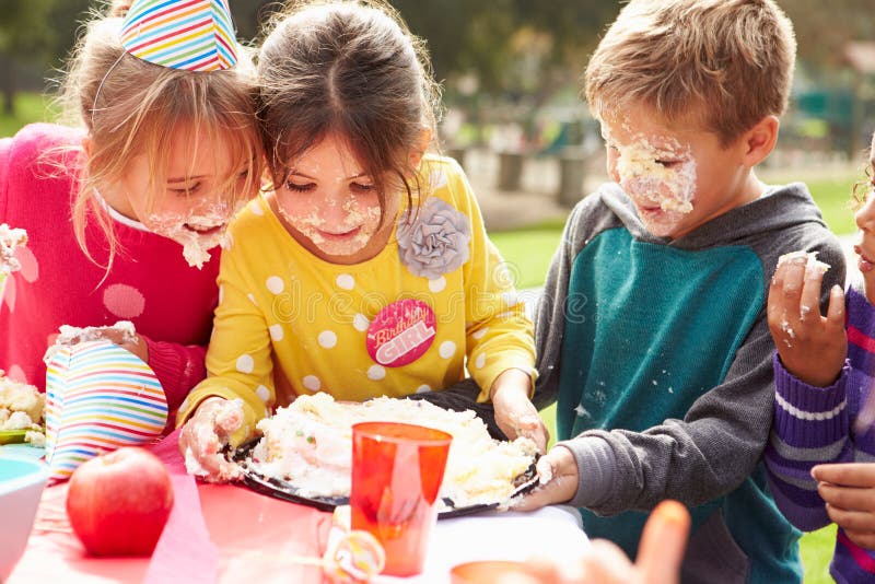 Group Of Children Having Outdoor Birthday Party royalty free stock photography Group Of Children Having Outdoor Birthday Party royalty free stock photography