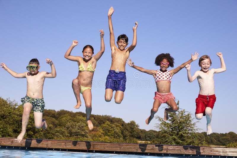 Group of five happy children jumping outdoors., Group of fi…