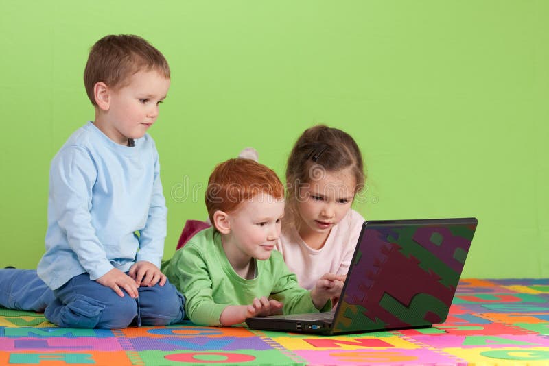 Group of children learning on kids computer