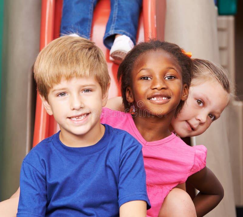 Group of children sitting behind each other