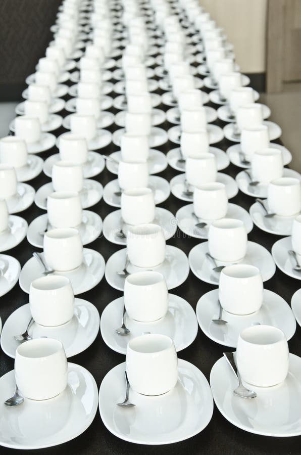 Group of coffee cups.empty cups for coffee.Many rows of white cup for service tea or coffee in breakfast at buffet event.white cup royalty free stock photo Group of coffee cups.empty cups for coffee.Many rows of white cup for service tea or coffee in breakfast at buffet event.white cup royalty free stock photo
