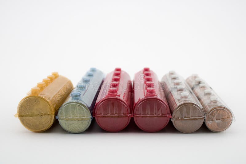 Group of coins rolls on white background. Rolls with euros