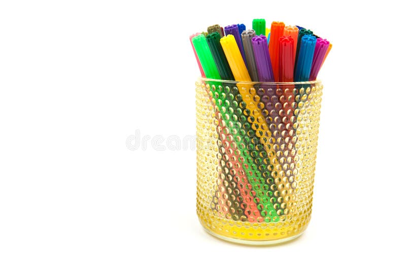 Group of color felt-tipped pens in a glass, white background