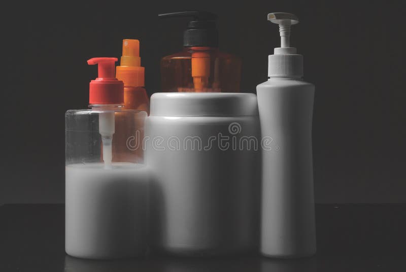 Group of cosmetic bottles on white