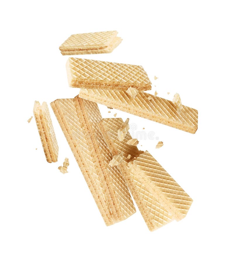 Group of crispy waffles crushed in the air close-up isolated on white background royalty free stock image