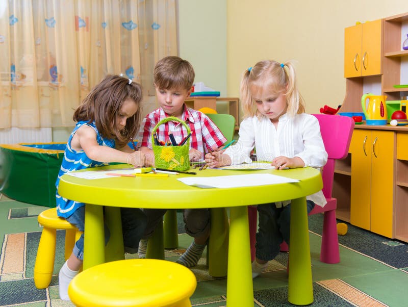 Group of cute little prescool kids playing royalty free stock photo