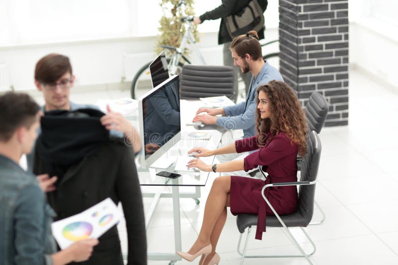 Group of designers working in a modern office stock images