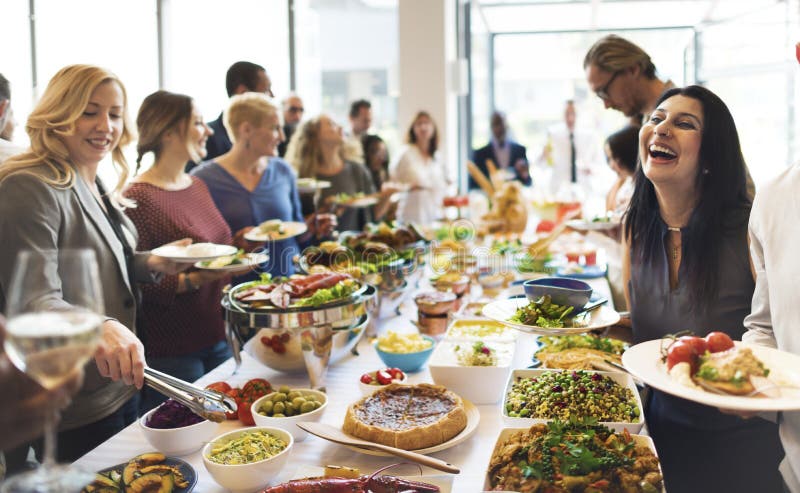 Group of diverse people are having lunch together.