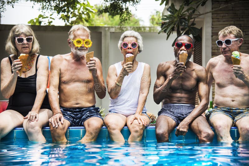 Group of diverse senior adults eating ice cream together