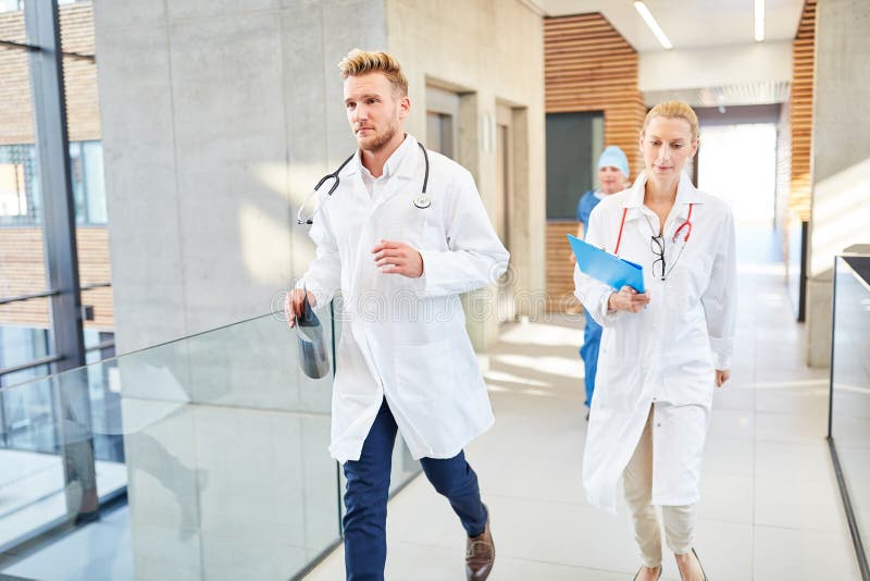 Group doctors are running fast in an emergency stock photos