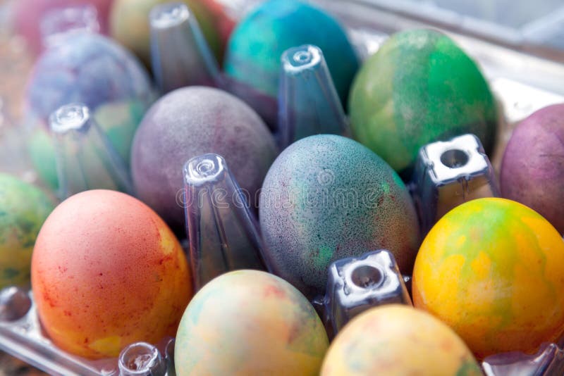 Group Of Easter Colored Eggs In Plastic Container Stock