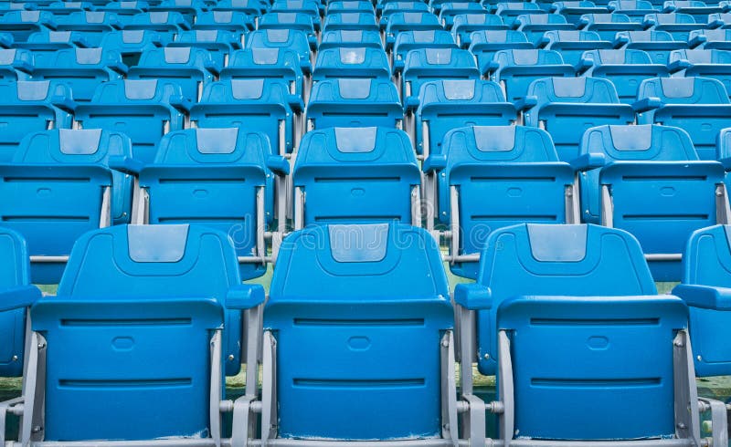 A group of empty seat or chair in stadium , theater or conxert. Arena, blue.