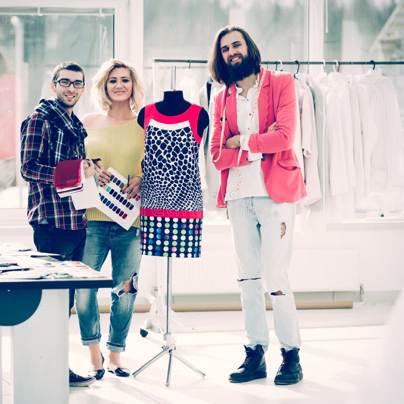 Group for Fashion Designers in Studio on a Background of New Mod Stock