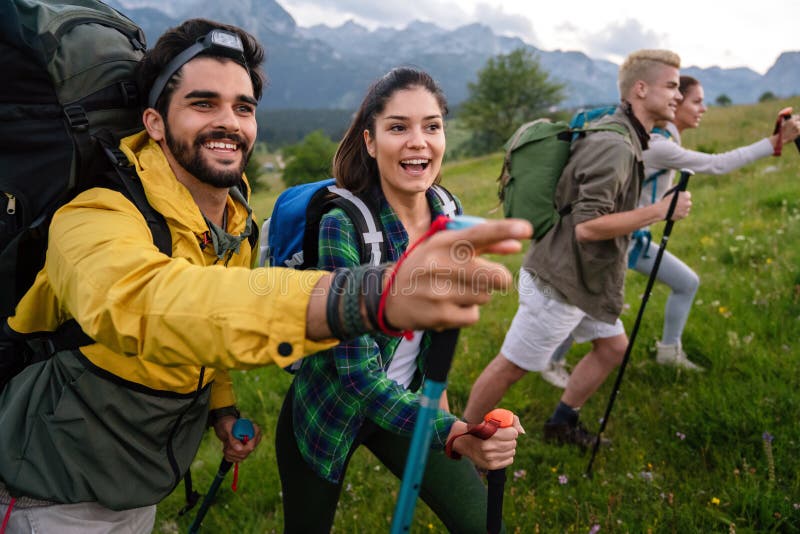 Group of Fit Healthy Friends Trekking in the Mountains Stock Photo ...
